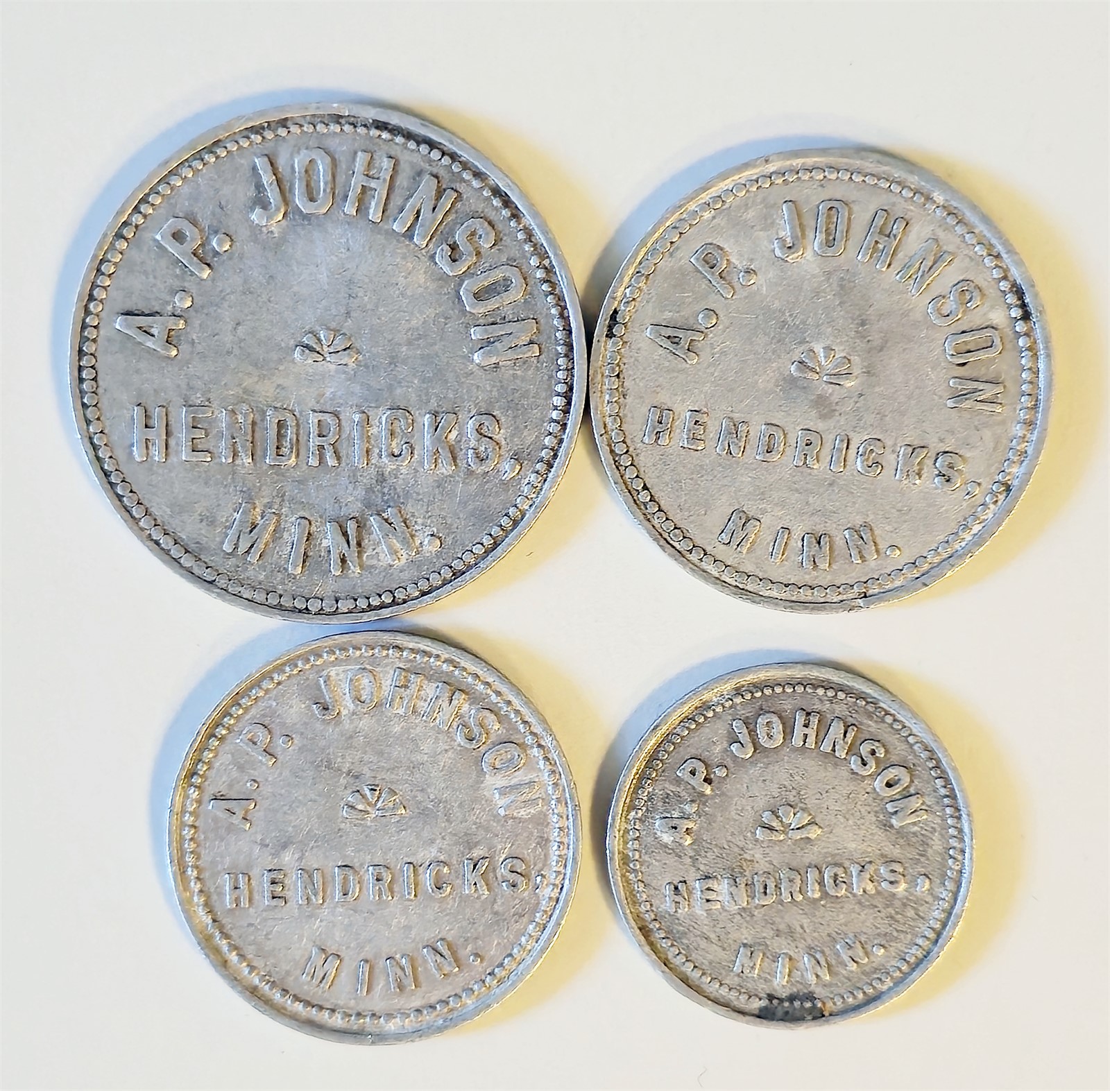 USA, MINNESOTA. A.P Johnson 4 pieces tokens Aluminium. VF.
